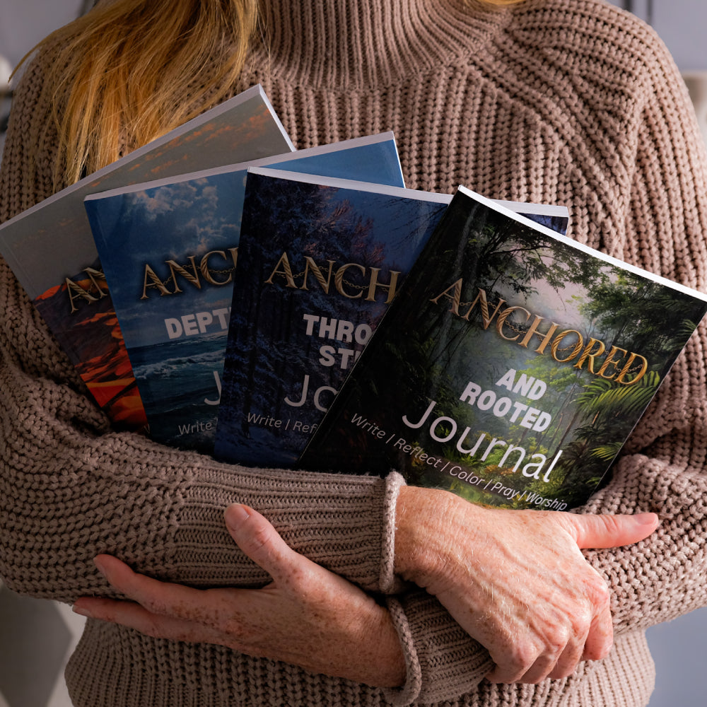 Anchored Paperback Bundle being held in Amanda Perrys arms.